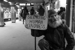 guy holding sign